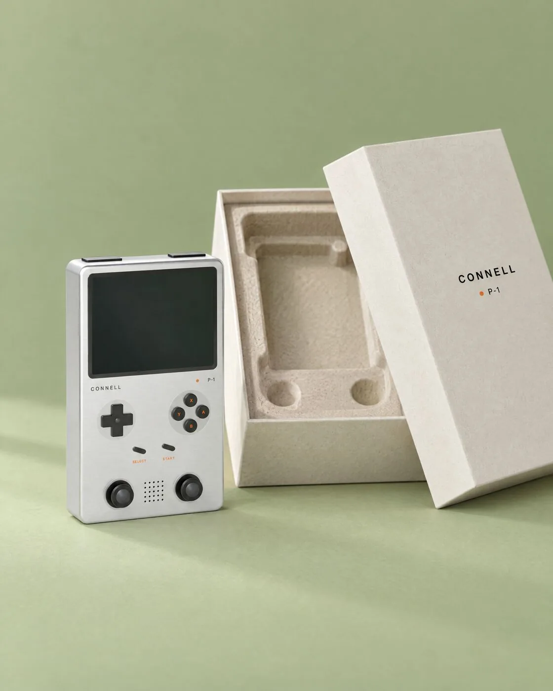 The P-1 standing beside its open off-white box with a moulded paper pulp tray.