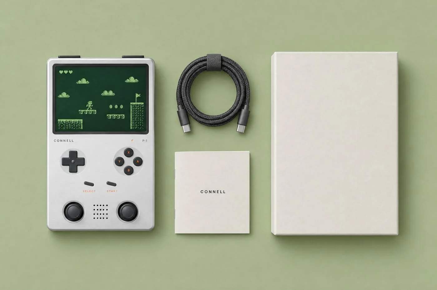 Flat lay of the P-1, a coiled braided cable, a printed guide and the box lid.